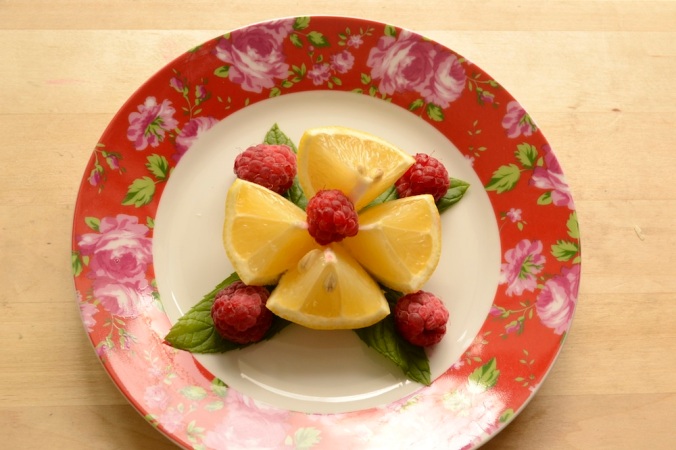 lemon raspberry mint, floral plate with fruit, cut lemon, lemon and mint, raspberry and mint