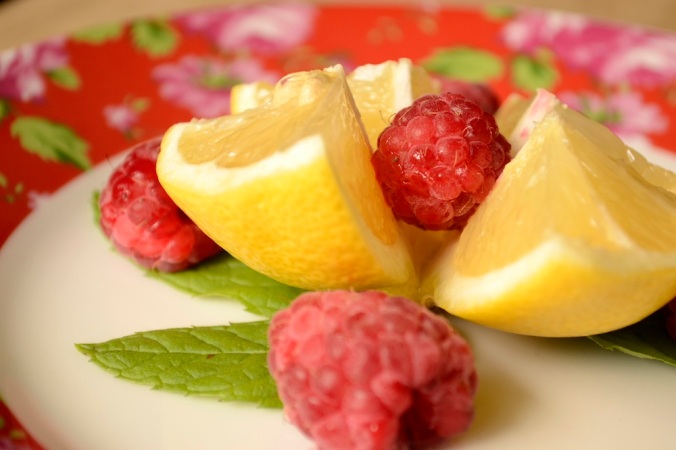 raspberry lemon mint, floral plate with fruit, lemon and mint, raspberry and mint, cut lemon